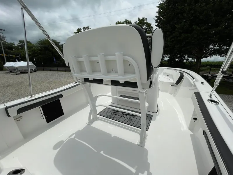 Slide: The Image of 2024 Tidewater 198 CC Adventure boat interior with seating and rod holders. - 27