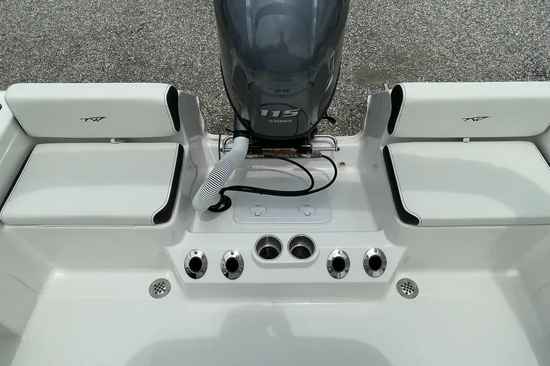 Slide: The Image of 2024 Tidewater 198 CC Adventure boat with Yamaha 115 engine, featuring seating and cup holders. - 28