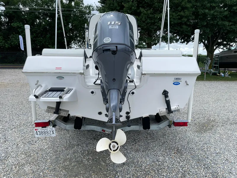 Slide: The Image of 2024 Tidewater 198 CC Adventure boat with Yamaha outboard motor, parked on gravel. - 33