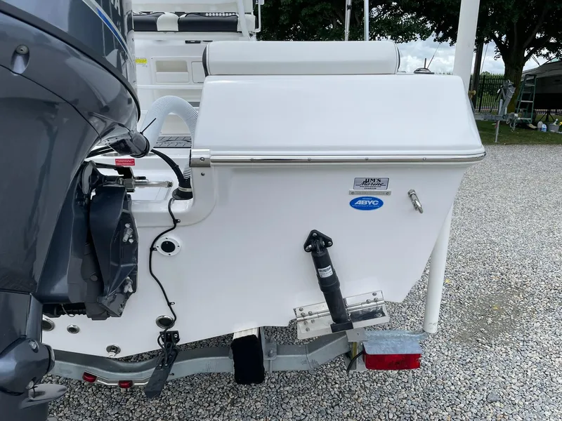 Slide: The Image of 2024 Tidewater 198 CC Adventure boat rear view with motor and trailer. - 34