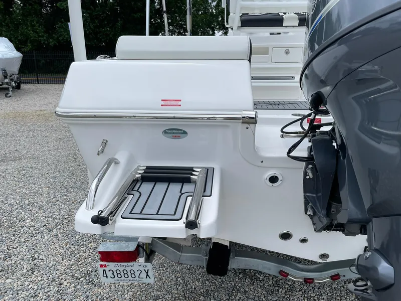 Slide: The Image of 2024 Tidewater 198 CC Adventure boat with Yamaha engine and Maryland license plate. - 35