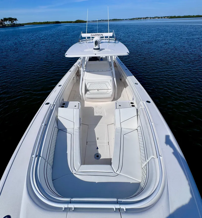 Slide: The Image of 2017 Intrepid 375 FE boat with spacious deck and Garmin equipment on calm water. - 12