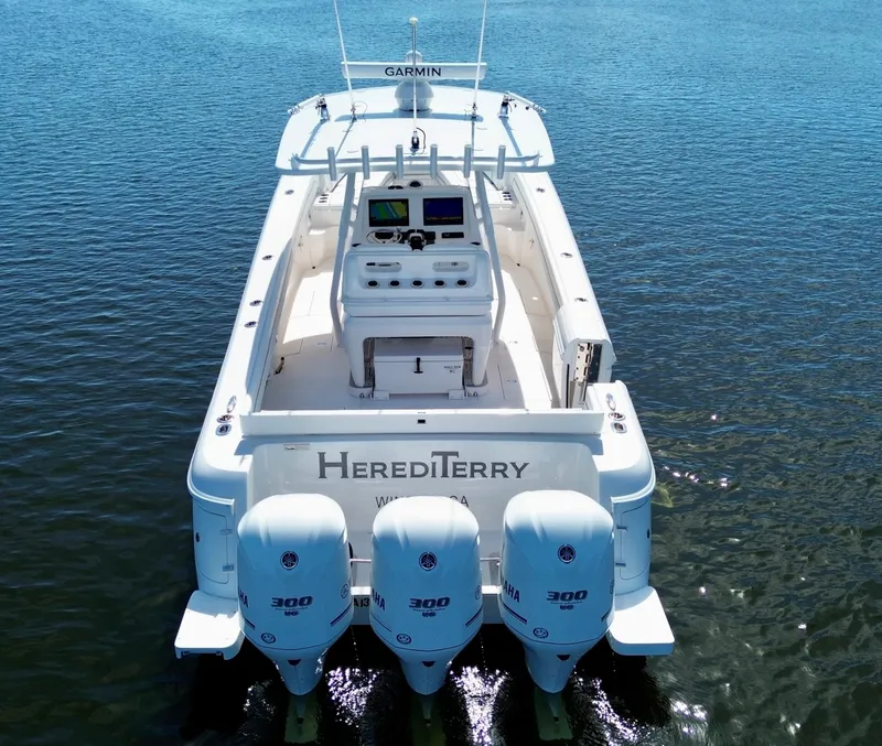 Slide: The Image of 2017 Intrepid 375 FE boat with triple Yamaha engines on calm water. - 22