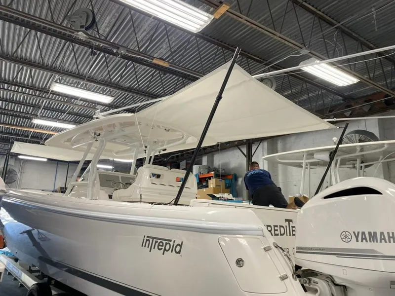 Slide: The Image of 2017 Intrepid 375 FE boat in a workshop with Yamaha engines. - 35