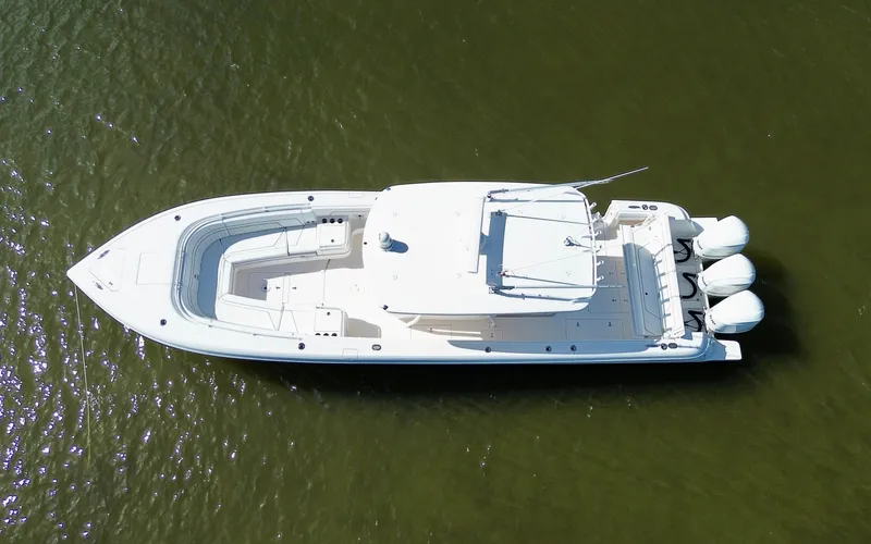 Slide: The Image of Aerial view of 2017 Intrepid 375 FE boat on calm water. - 36