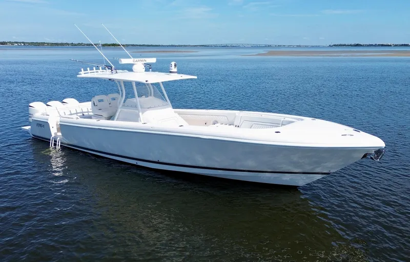 Slide: The Image of 2017 Intrepid 375 FE boat on calm water, clear sky background. - 14