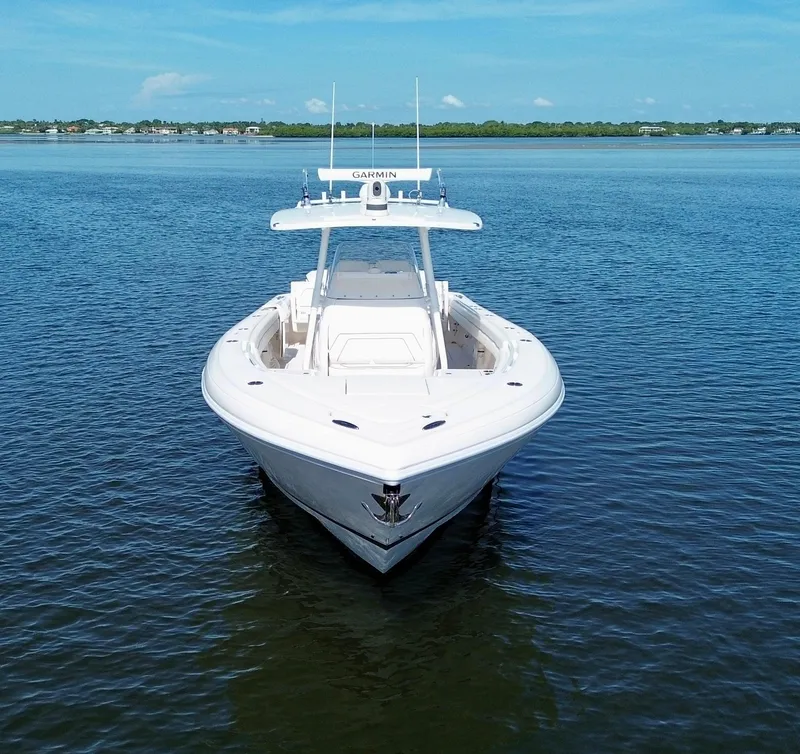 Slide: The Image of 2017 Intrepid 375 FE boat on calm water, clear sky background. - 27