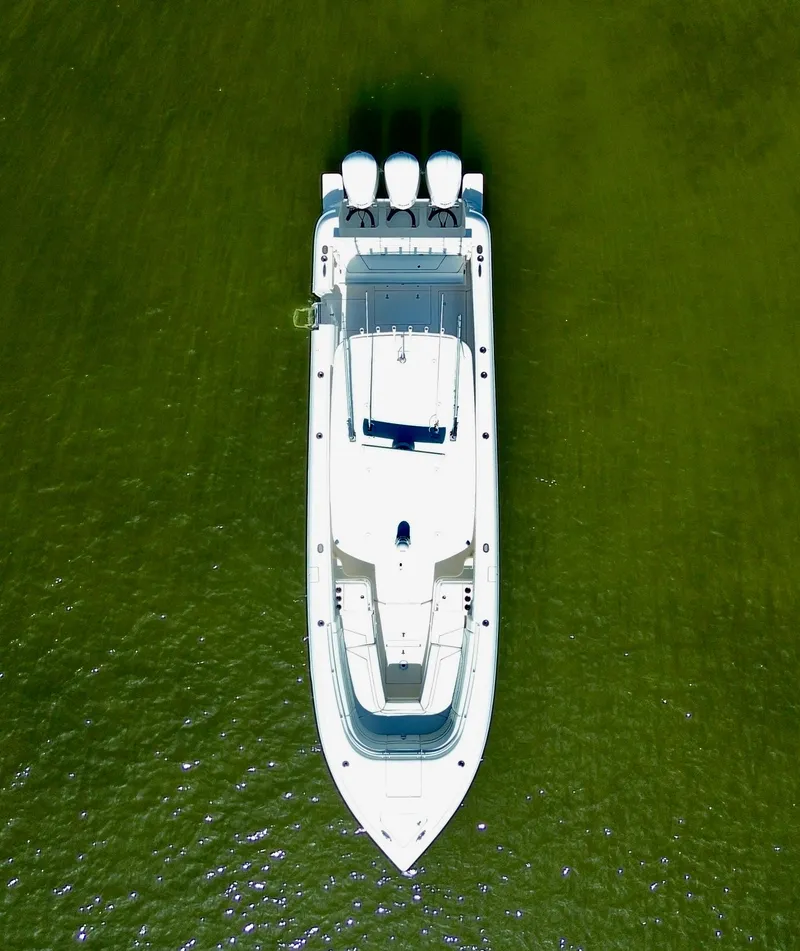 Slide: The Image of Aerial view of 2017 Intrepid 375 FE boat on green water. - 31