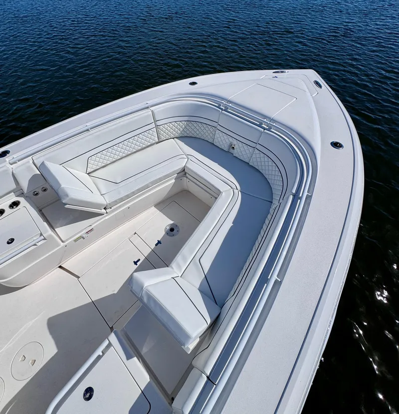 Slide: The Image of 2017 Intrepid 375 FE boat with spacious seating on calm water. - 4