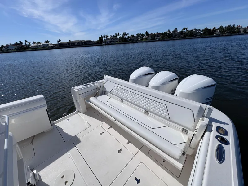 Slide: The Image of 2017 Intrepid 375 FE boat with triple Yamaha engines on a sunny day. - 7