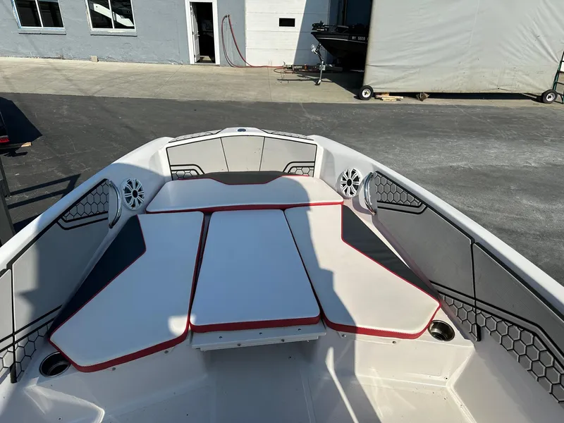 Slide: The Image of 2018 Scarab 195 Open ID boat interior with cushioned seating and speakers. - 4