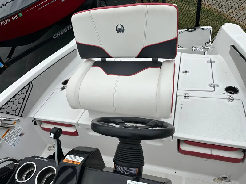 Slide: The Image of 2018 Scarab 195 Open ID boat interior with steering wheel and seat. - 5