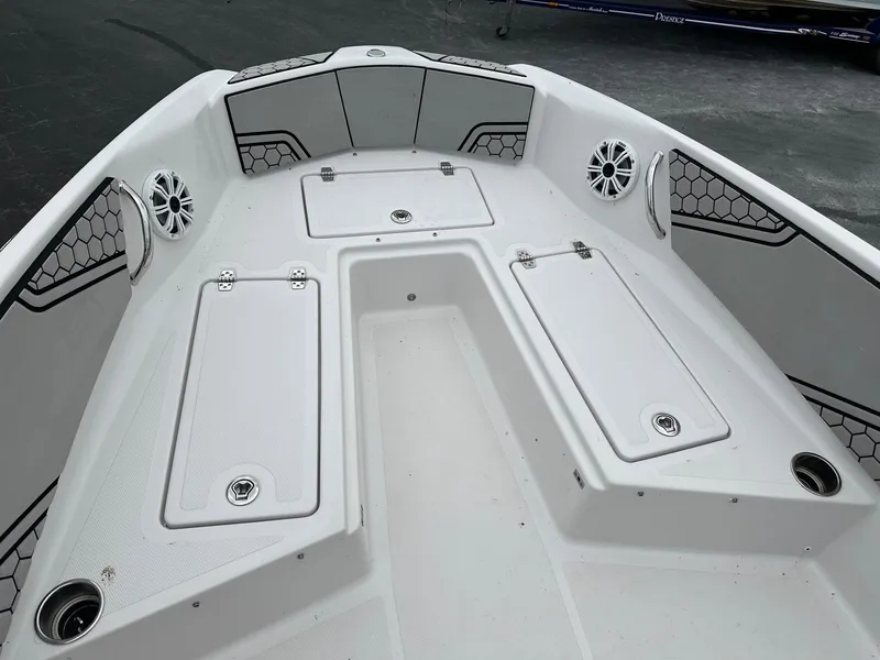 Slide: The Image of 2018 Scarab 195 Open ID boat interior with storage compartments and speakers. - 6