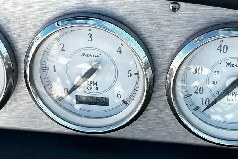 Slide: The Image of Close-up of Faria gauges on a 2008 Regal 2200 Bowrider boat dashboard. - 13
