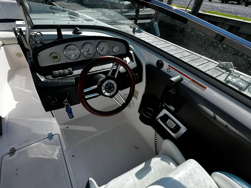 Slide: The Image of 2008 Regal 2200 Bowrider dashboard with steering wheel and gauges. - 16
