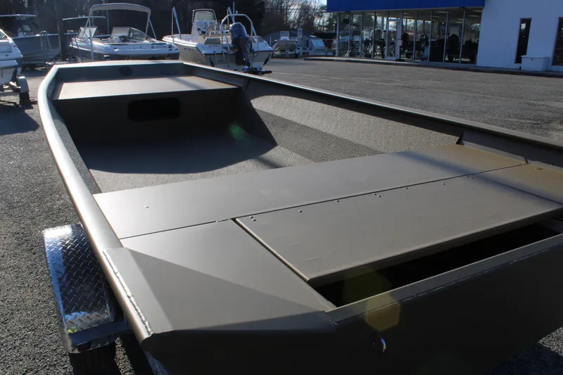 Slide: The Image of 2025 G3 Gator Tough 1860 VBW boat on trailer, displayed outdoors. - 7