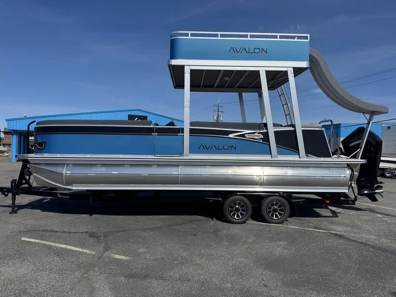 The Image of 2025 Avalon 2585 27 Catalina CRFS pontoon boat with slide, parked on trailer. - 1