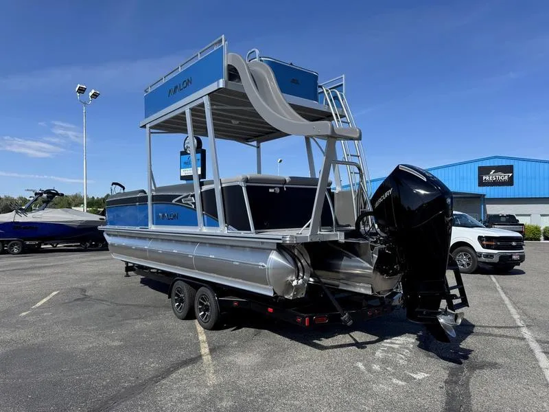 Slide: The Image of 2025 Avalon 2585 27 Catalina CRFS pontoon boat with slide and outboard motor. - 10