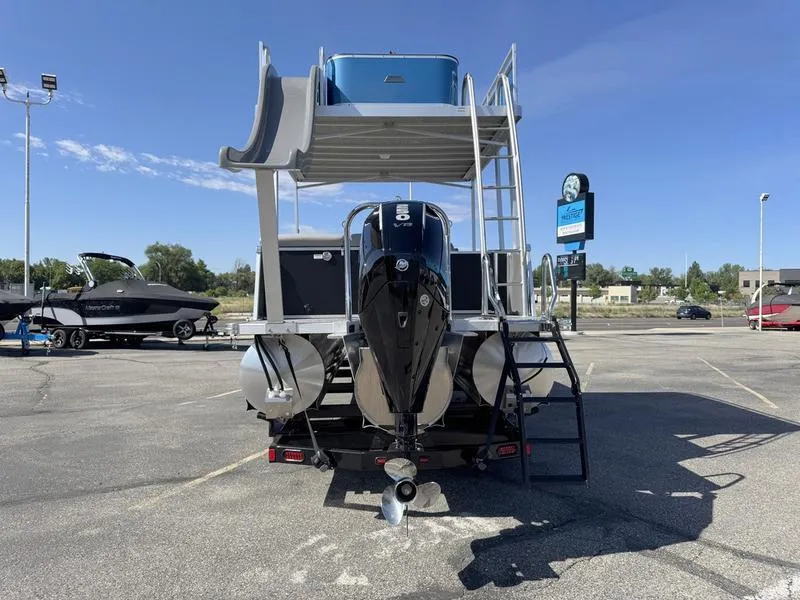 Slide: The Image of 2025 Avalon 2585 27 Catalina CRFS pontoon boat with slide and outboard motor. - 12