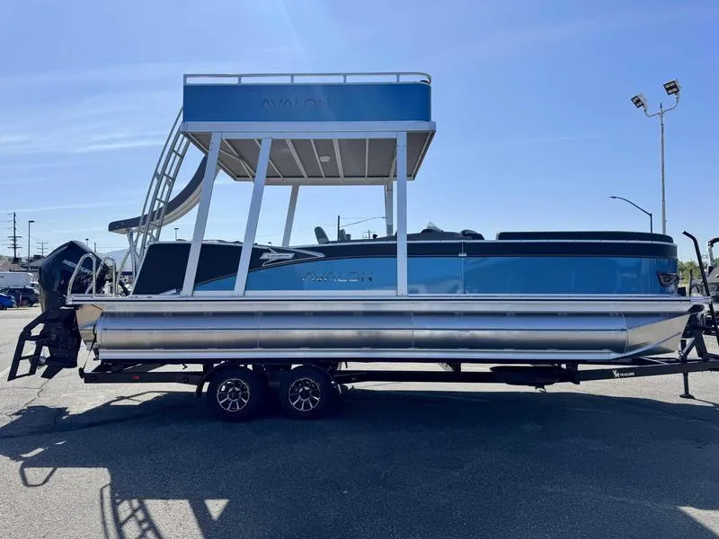 Slide: The Image of 2025 Avalon 2585 27 Catalina CRFS pontoon boat on trailer, blue and silver design. - 17