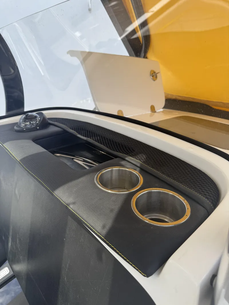 Slide: The Image of 2023 Renegade 38' Open boat interior with cup holders and storage compartment. - 13