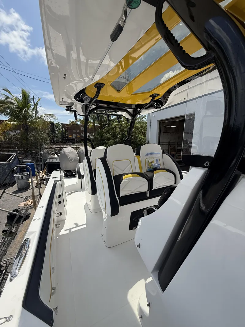 Slide: The Image of 2023 Renegade 38' Open boat interior with white and yellow seating. - 14
