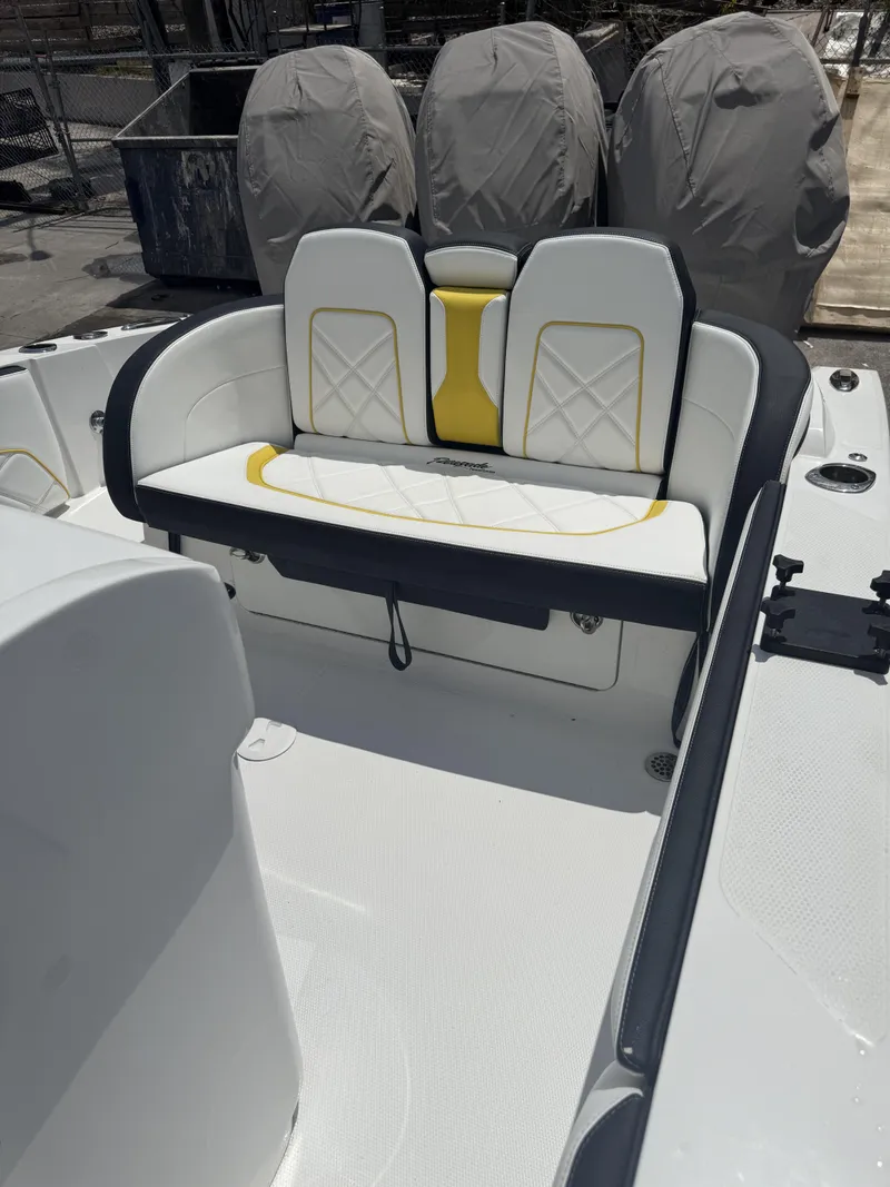 Slide: The Image of 2023 Renegade 38' Open boat interior with white and yellow seating. - 8