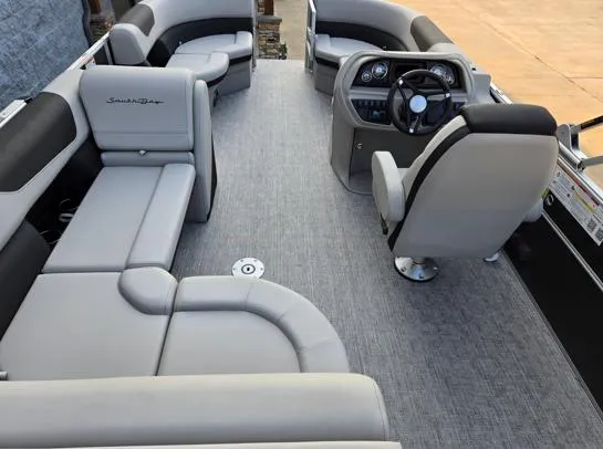 Slide: The Image of 2026 South Bay 224FCR LE pontoon boat interior with gray seating and modern helm. - 10