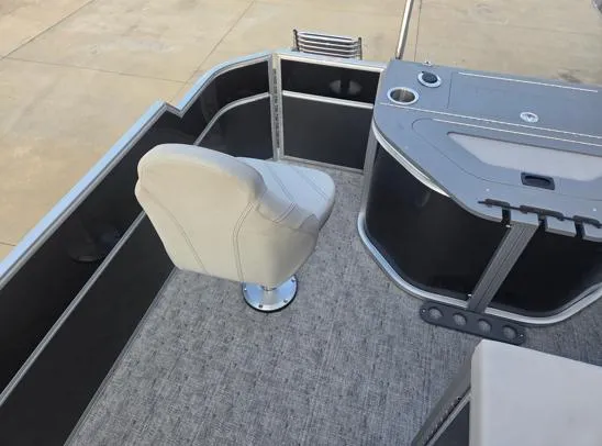 Slide: The Image of Pontoon boat interior with swivel chair and control panel, South Bay 224FCR LE, 2026 model. - 12