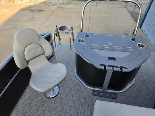 Slide: The Image of 2026 South Bay 224FCR LE boat interior with swivel chair and control console. - 13
