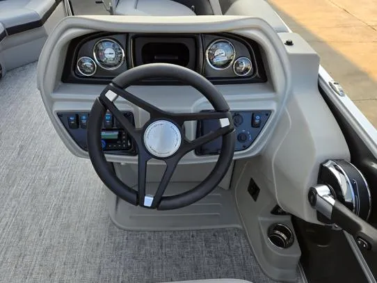 Slide: The Image of Steering console of 2026 South Bay 224FCR LE boat with modern controls and gauges. - 8