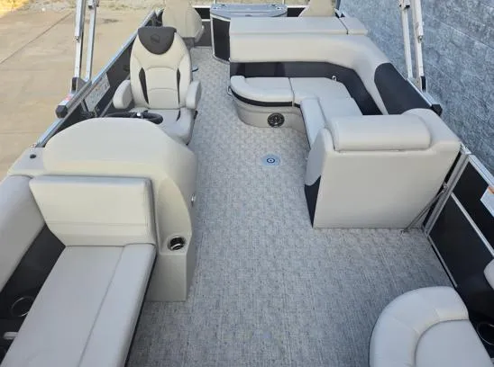 Slide: The Image of 2026 South Bay 224FCR LE pontoon boat interior with plush seating and modern design. - 9