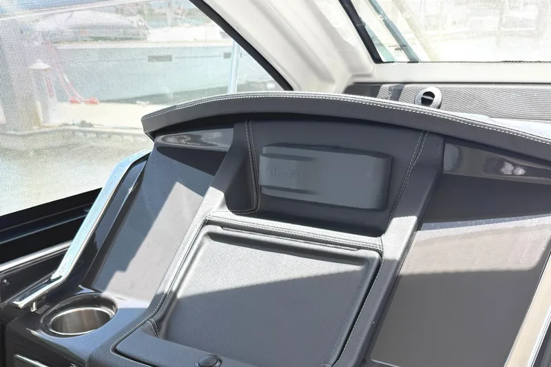 Slide: The Image of Interior dashboard of 2016 Monterey 360 Sport Coupe with cup holder and sleek design. - 11