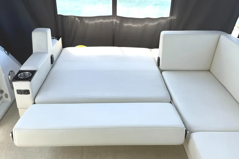 Slide: The Image of Luxurious white seating area on 2016 Monterey 360 Sport Coupe yacht. - 13