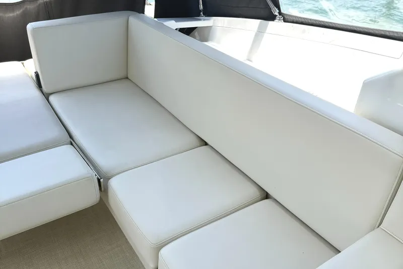 Slide: The Image of White leather seating on 2016 Monterey 360 Sport Coupe boat interior. - 14