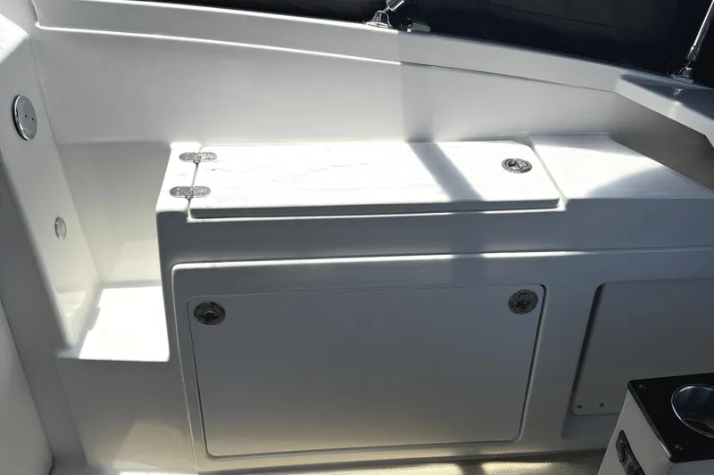 Slide: The Image of 2016 Monterey 360 Sport Coupe interior with sleek white cabinetry and storage compartments. - 16