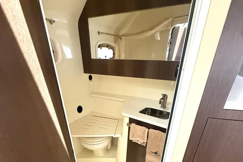 Slide: The Image of 2016 Monterey 360 Sport Coupe bathroom with sink, mirror, and toilet. - 23