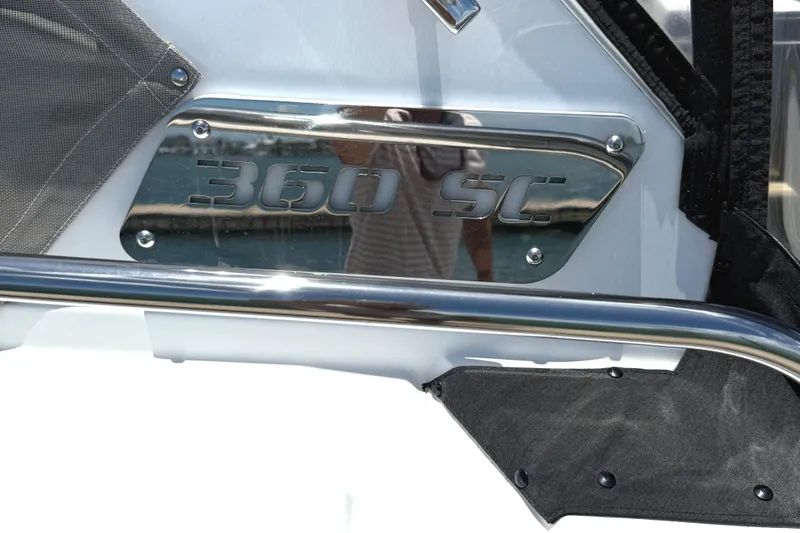 Slide: The Image of 2016 Monterey 360 Sport Coupe emblem on a boat, featuring chrome detailing. - 6