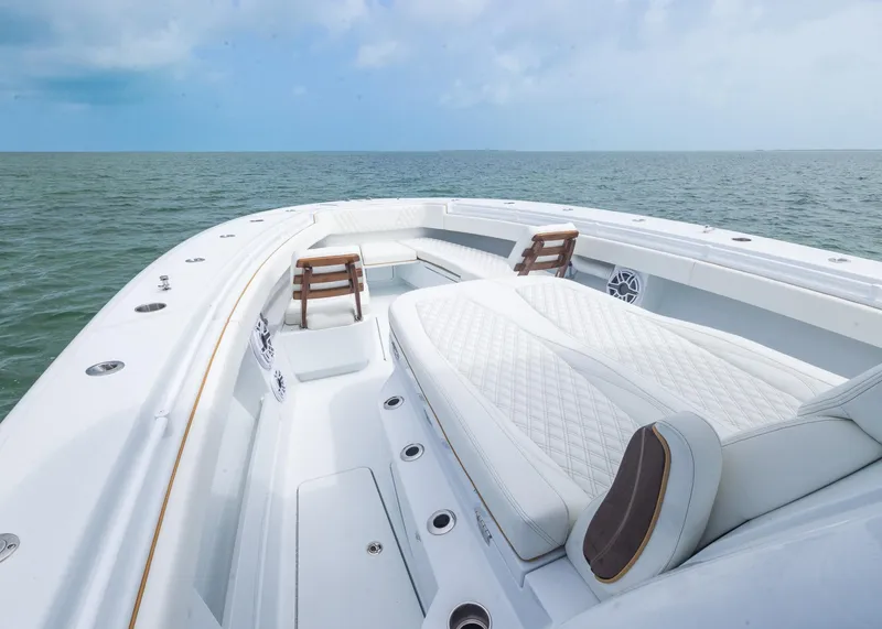 Slide: The Image of 2025 Invincible 43 Open Fisherman boat with luxurious seating on open water. - 10