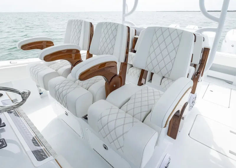Slide: The Image of Luxurious seating on 2025 Invincible 43 Open Fisherman boat, featuring elegant white upholstery. - 16