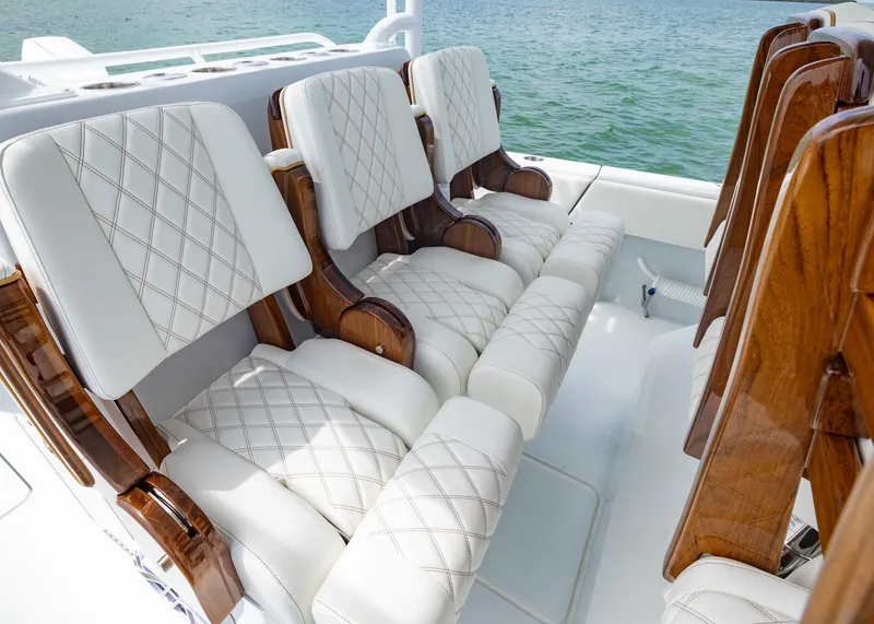 Slide: The Image of Luxurious seating on 2025 Invincible 43 Open Fisherman boat with quilted white upholstery. - 19