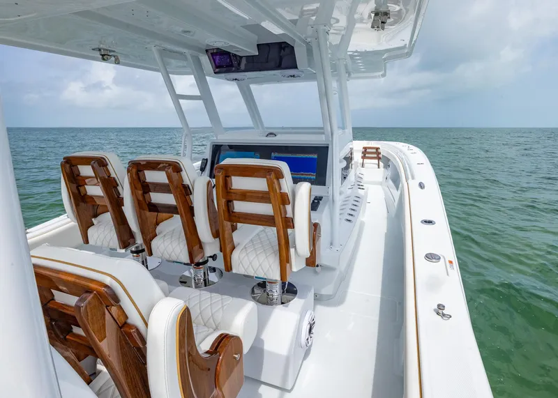 Slide: The Image of 2025 Invincible 43 Open Fisherman boat with luxurious seating on open water. - 21