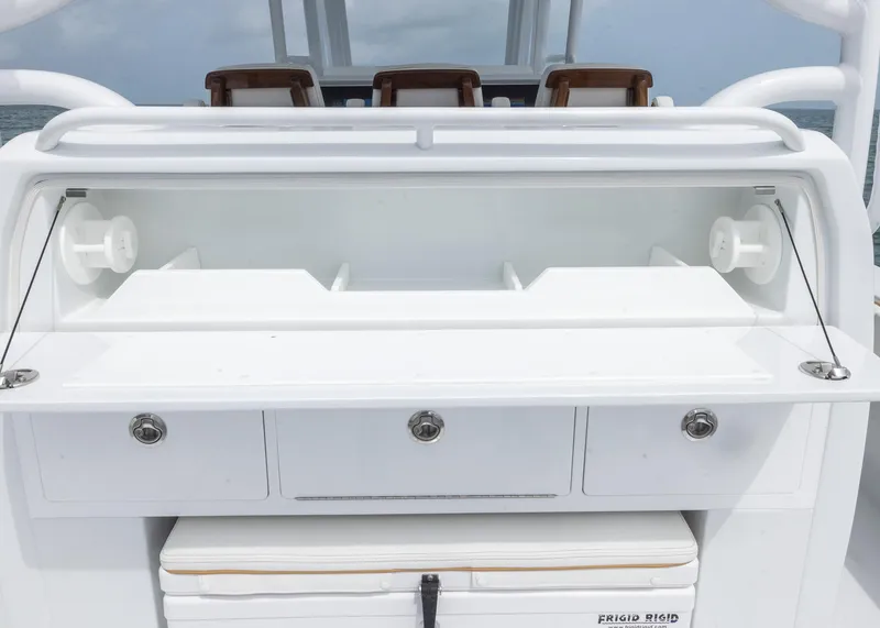 Slide: The Image of 2025 Invincible 43 Open Fisherman boat with storage compartments and seating. - 24