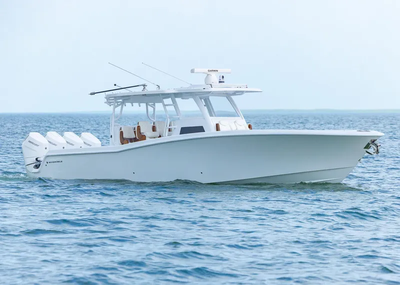 Slide: The Image of 2025 Invincible 43 Open Fisherman boat cruising on calm ocean waters. - 3