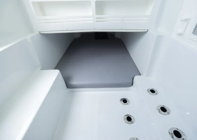 Slide: The Image of 2025 Invincible 43 Open Fisherman interior with sleek seating and drainage system. - 31