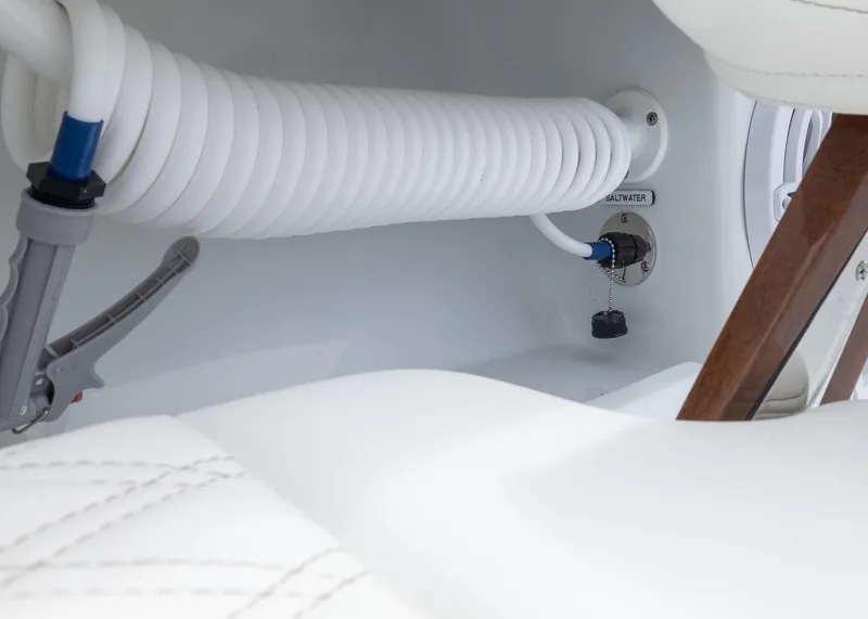 Slide: The Image of 2025 Invincible 43 Open Fisherman boat interior with saltwater hose and fittings. - 36