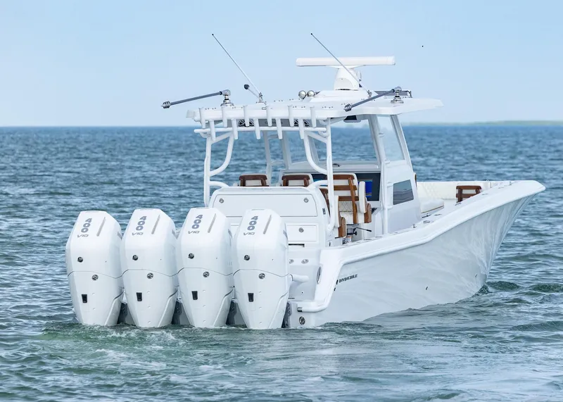 Slide: The Image of 2025 Invincible 43 Open Fisherman boat with four powerful outboard engines on the ocean. - 4