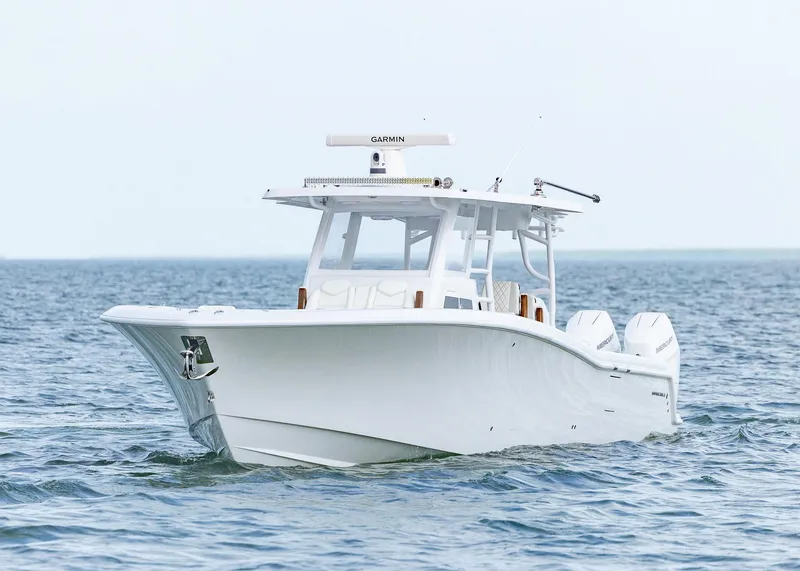 Slide: The Image of 2025 Invincible 43 Open Fisherman boat on calm ocean waters. - 5