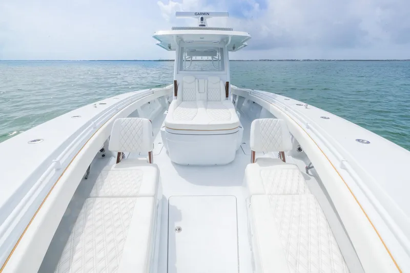 Slide: The Image of 2025 Invincible 43 Open Fisherman boat with luxurious seating on calm waters. - 6
