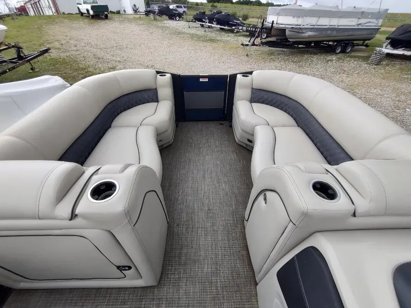 Slide: The Image of 2020 Barletta L23QC pontoon boat interior with plush seating and cup holders. - 18